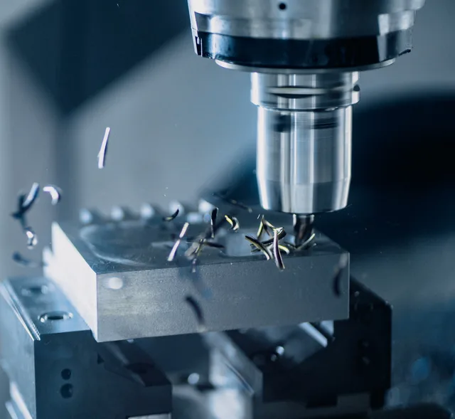 Close-up of a CNC milling machine working on metal for precise manufacturing. Identifying automations that no longer match the process